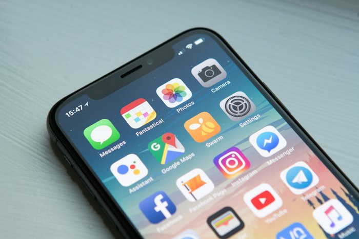 Mobile app development company building an app shown on a phone